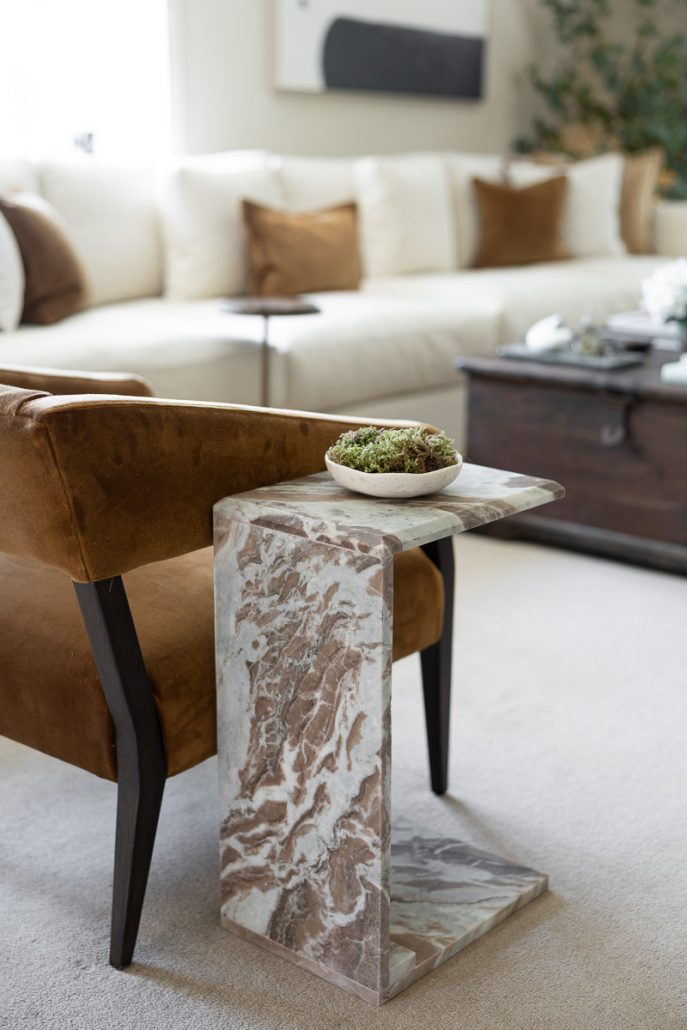 cosy living space with cream sofa, wooden coffee table, and styled décor.