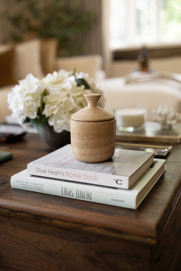 cosy living space with cream sofa, wooden coffee table, and styled décor.