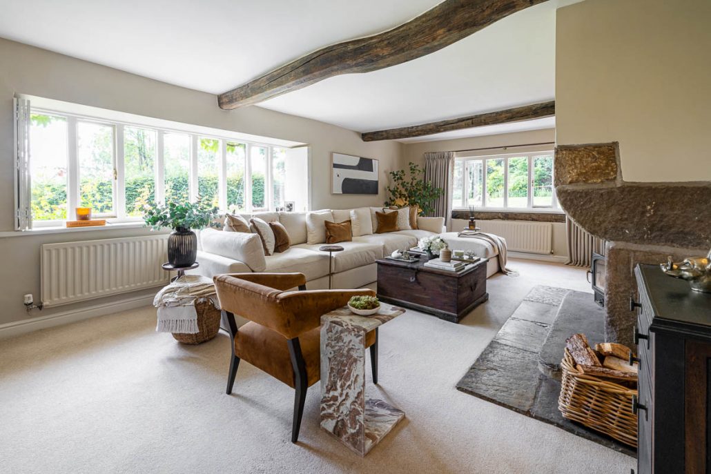 cosy living space with cream sofa, wooden coffee table, and styled décor.