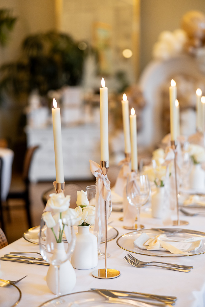 Table setting close up with roses and candles