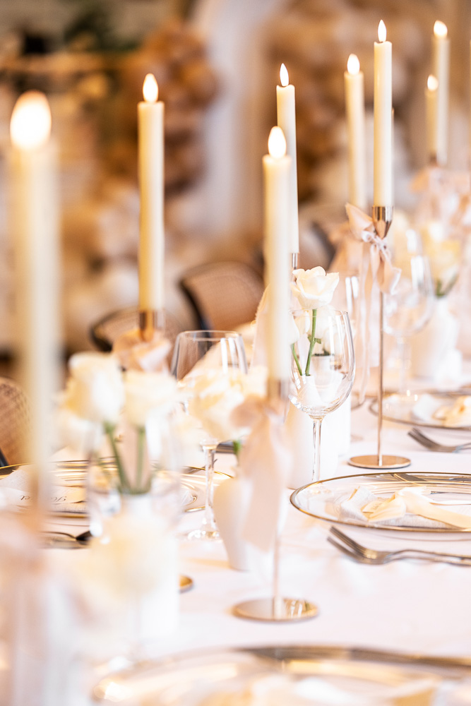 Table setting close up with roses and candles
