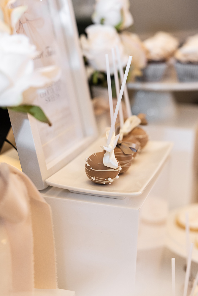 Dessert table with sweets and roses
