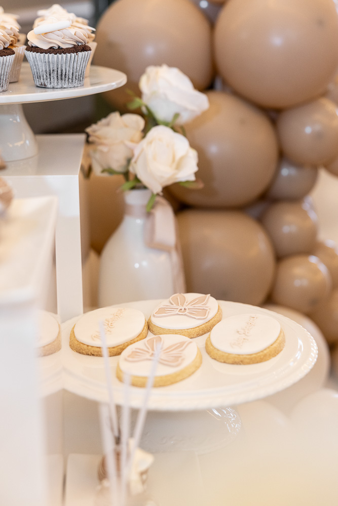 Dessert table with sweets and roses