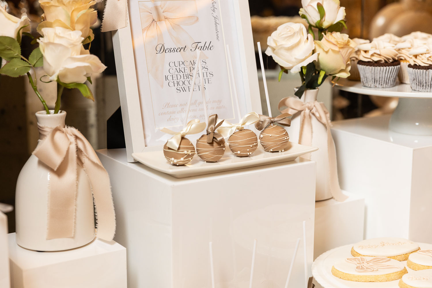 Dessert table with sweets and roses