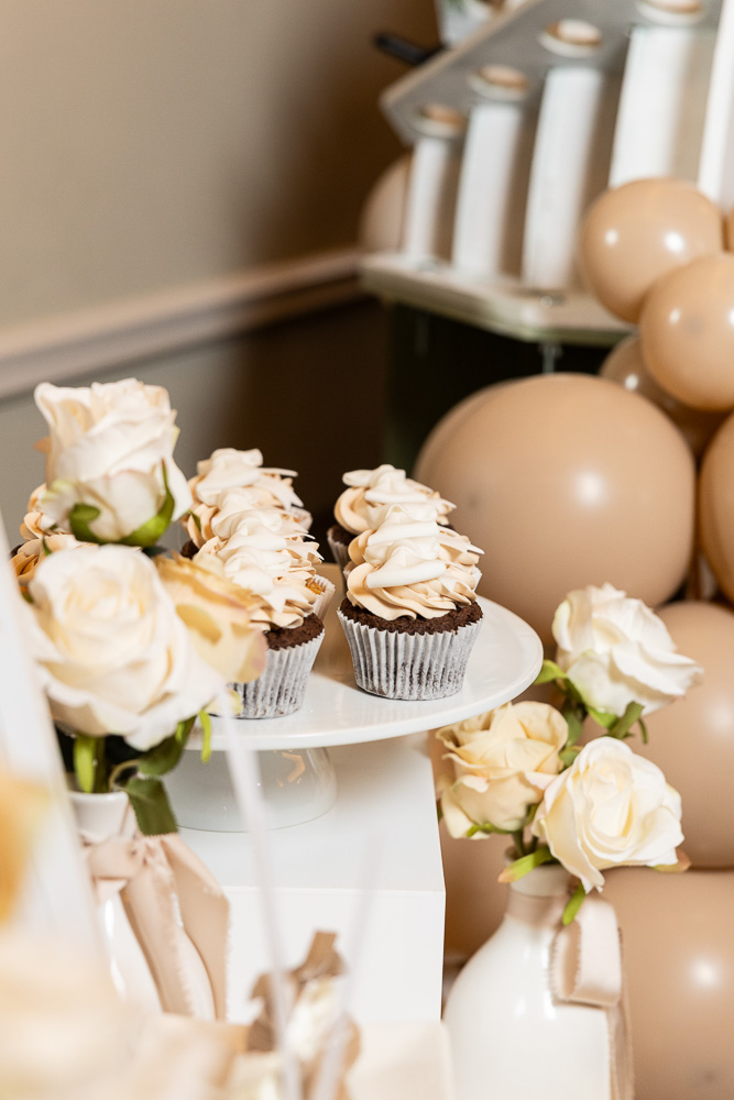 Dessert table with sweets and roses