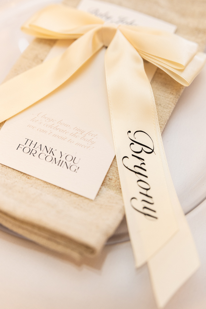 Long table with candles and balloon backdrop