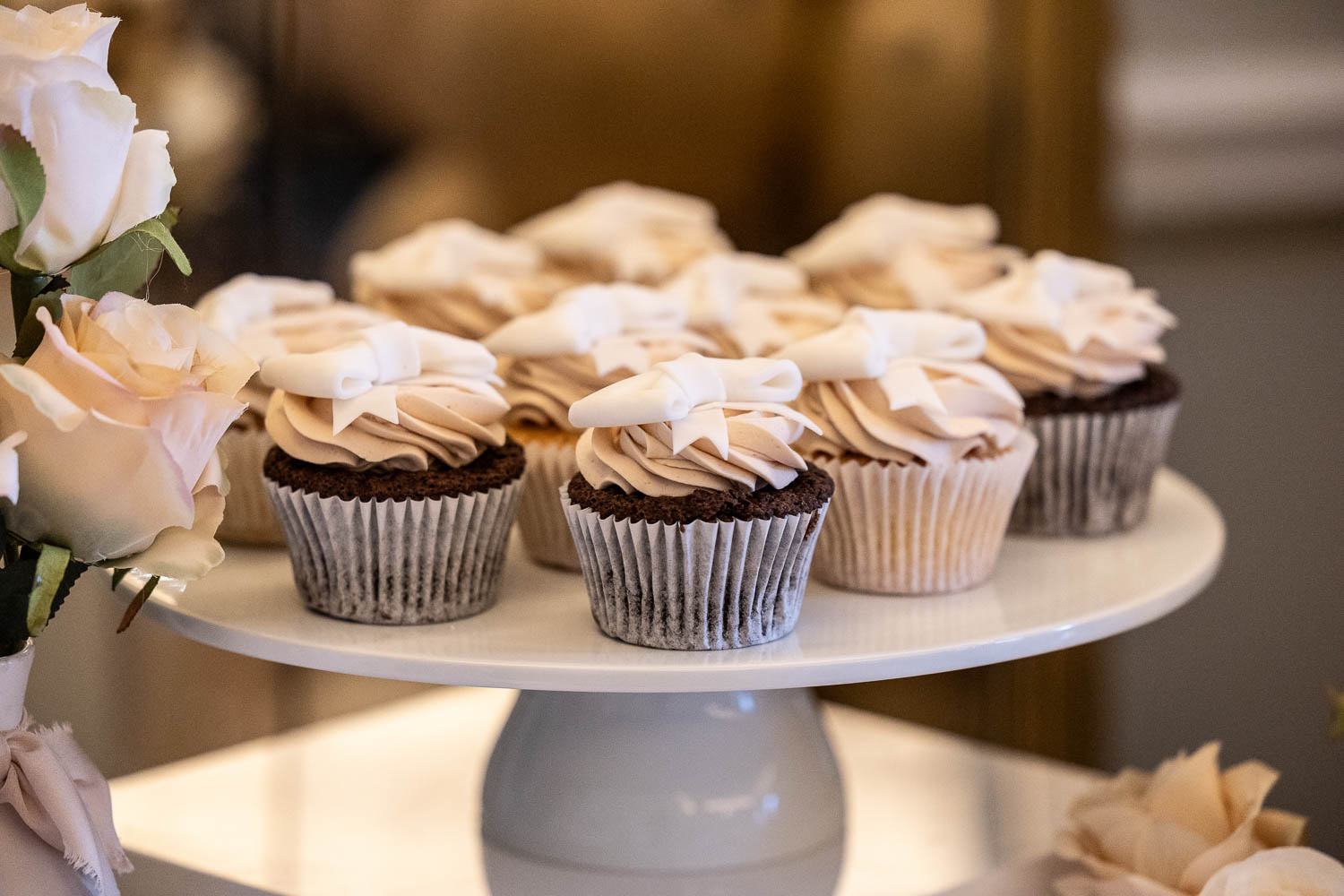 Dessert table with sweets and roses