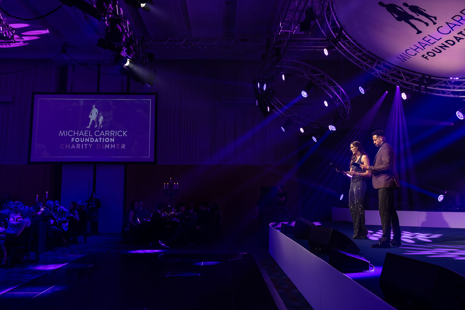 hosts at a charity event at the deansgate hotel manchester