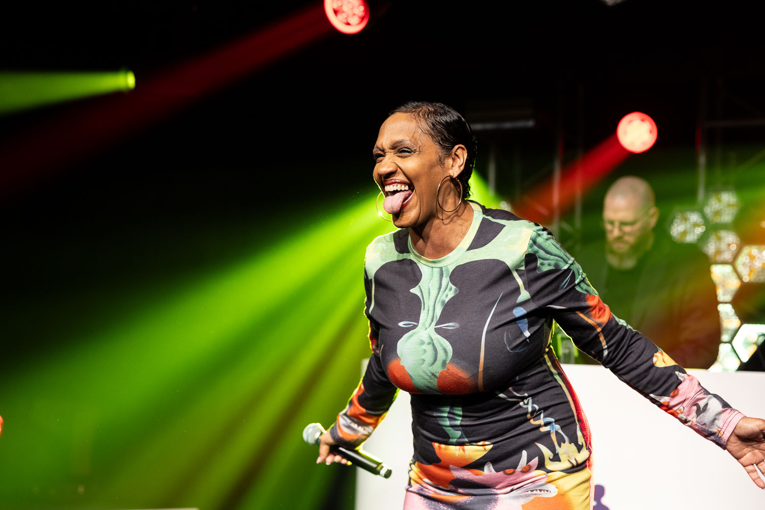 julie mcknight entertaining the guests at a charity dinner