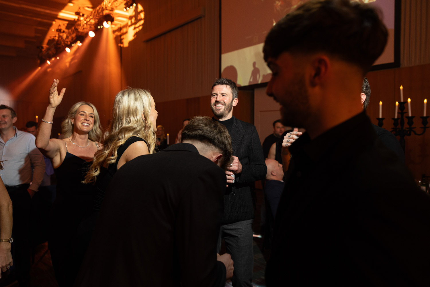 julie mcknight entertaining the guests at a charity dinner