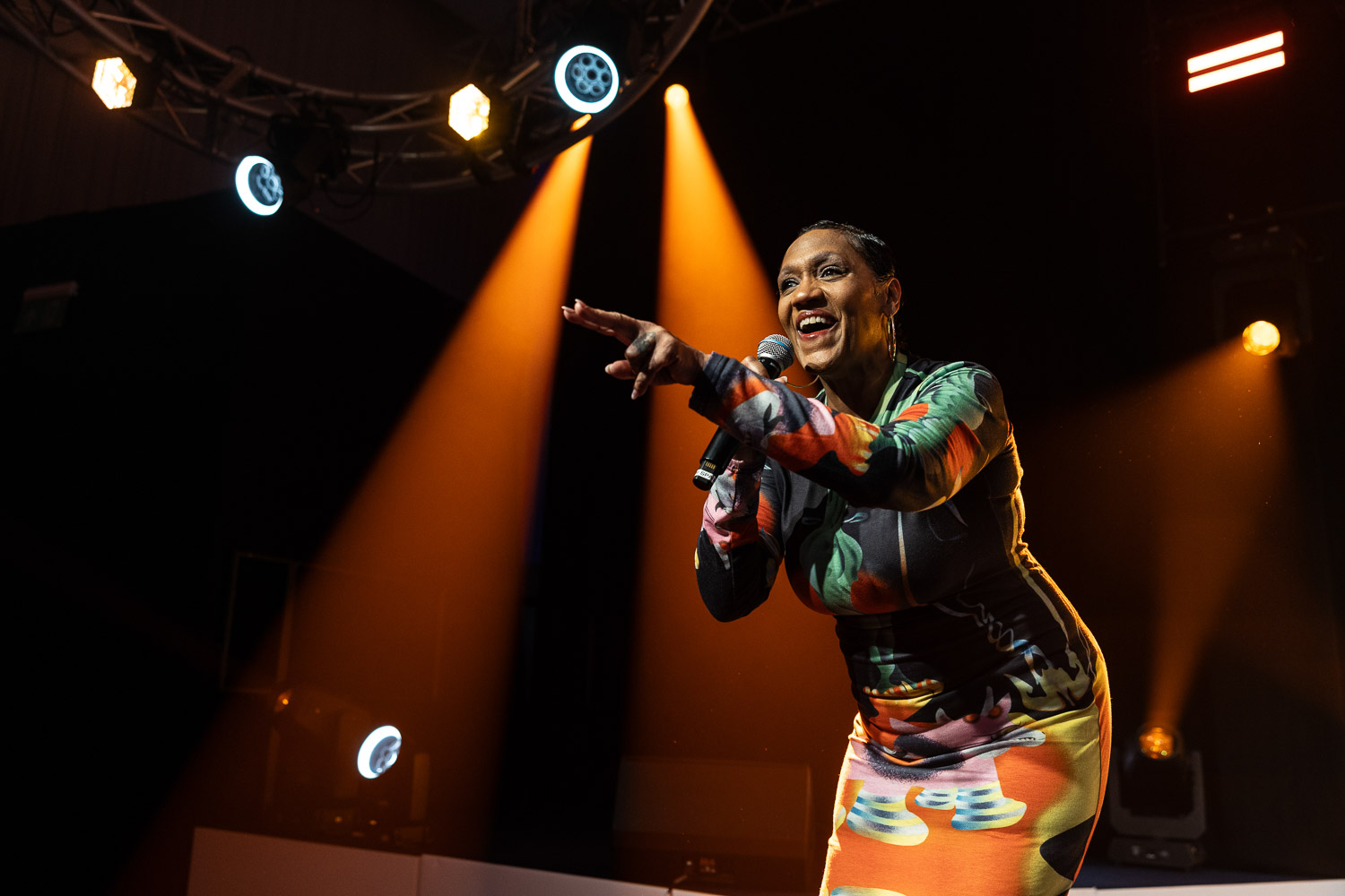 julie mcknight entertaining the guests at a charity dinner