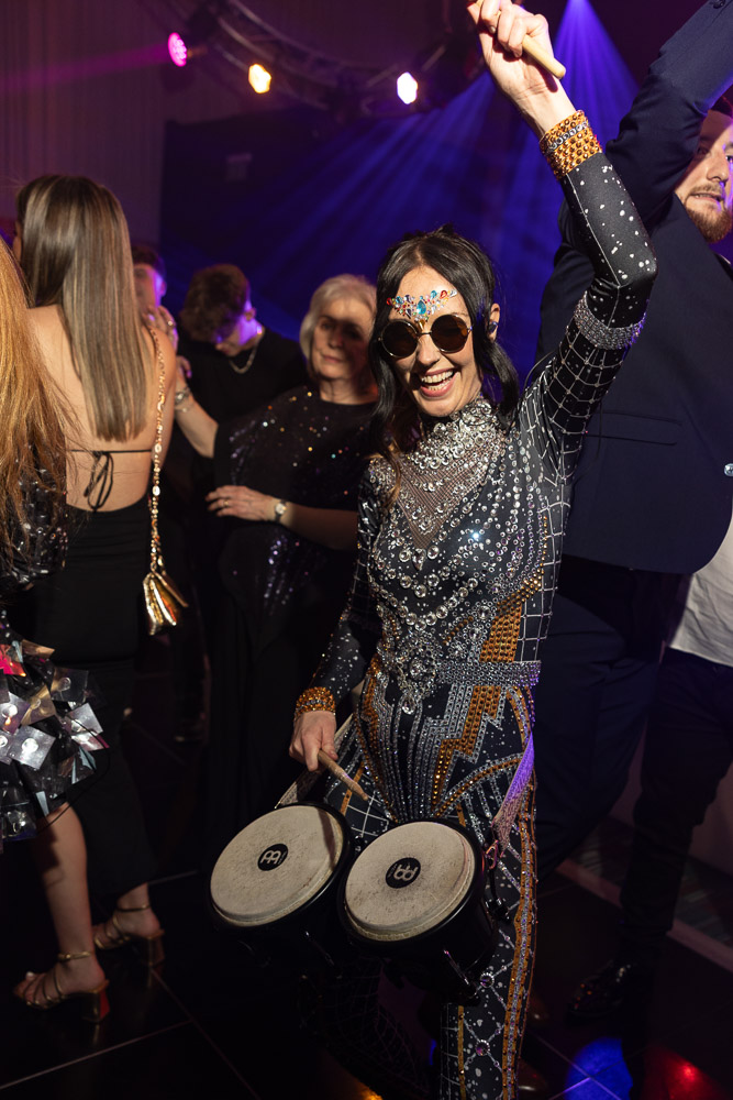 julie mcknight entertaining the guests at a charity dinner