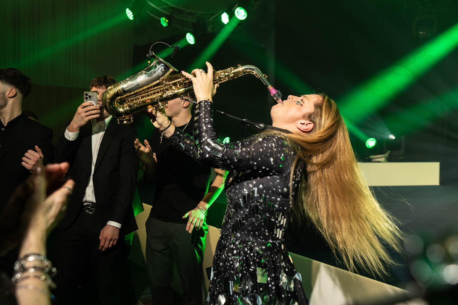 julie mcknight entertaining the guests at a charity dinner