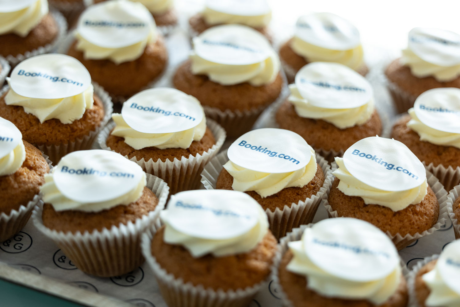 Booking.com branded cupcakes prepared for guests at a corporate event in the Manchester office