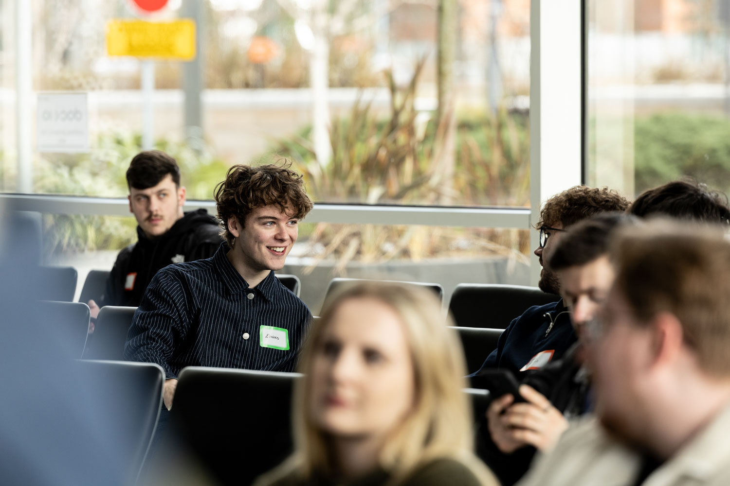 Students registering and networking at the Royal Television Society student event at Dock 10, Conference Photography Manchester.