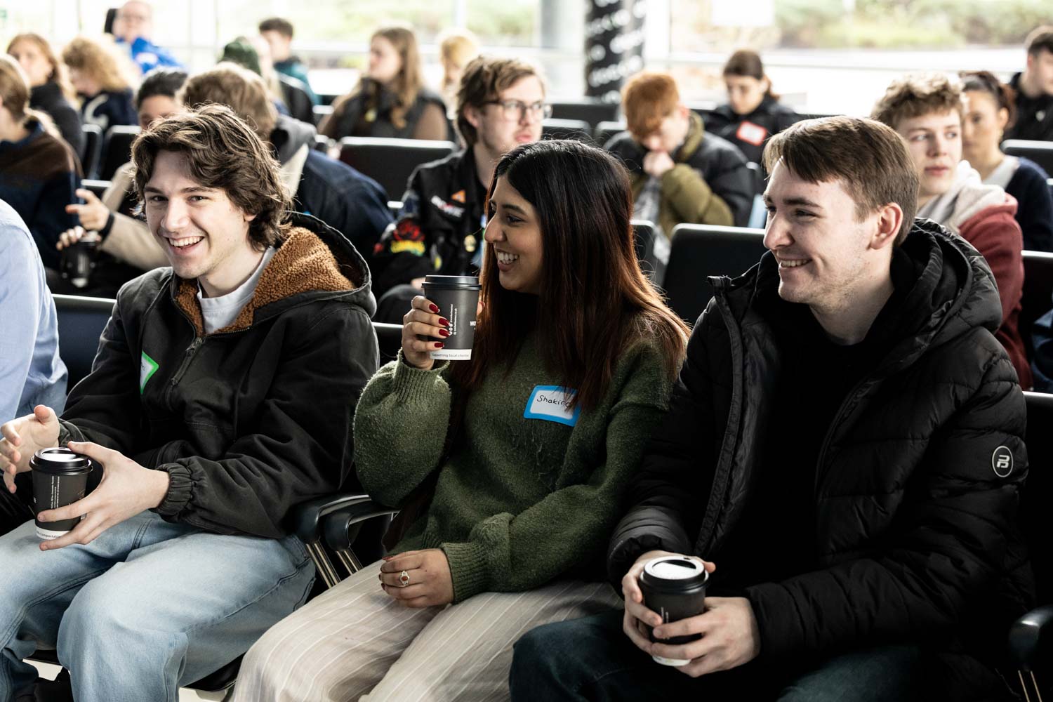 Students registering and networking at the Royal Television Society student event at Dock 10, Conference Photography Manchester.