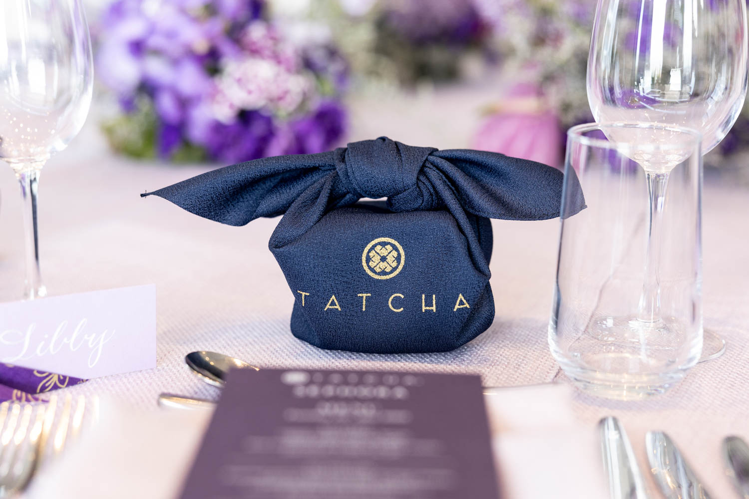 Tatcha Event Table Display with Purple Accents