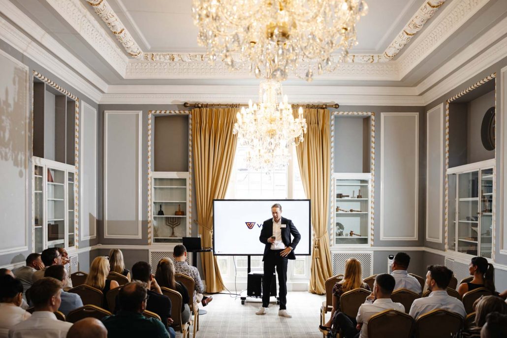 Business speaker raising a toast with audience at Manchester conference event, Conference Photographer Manchester