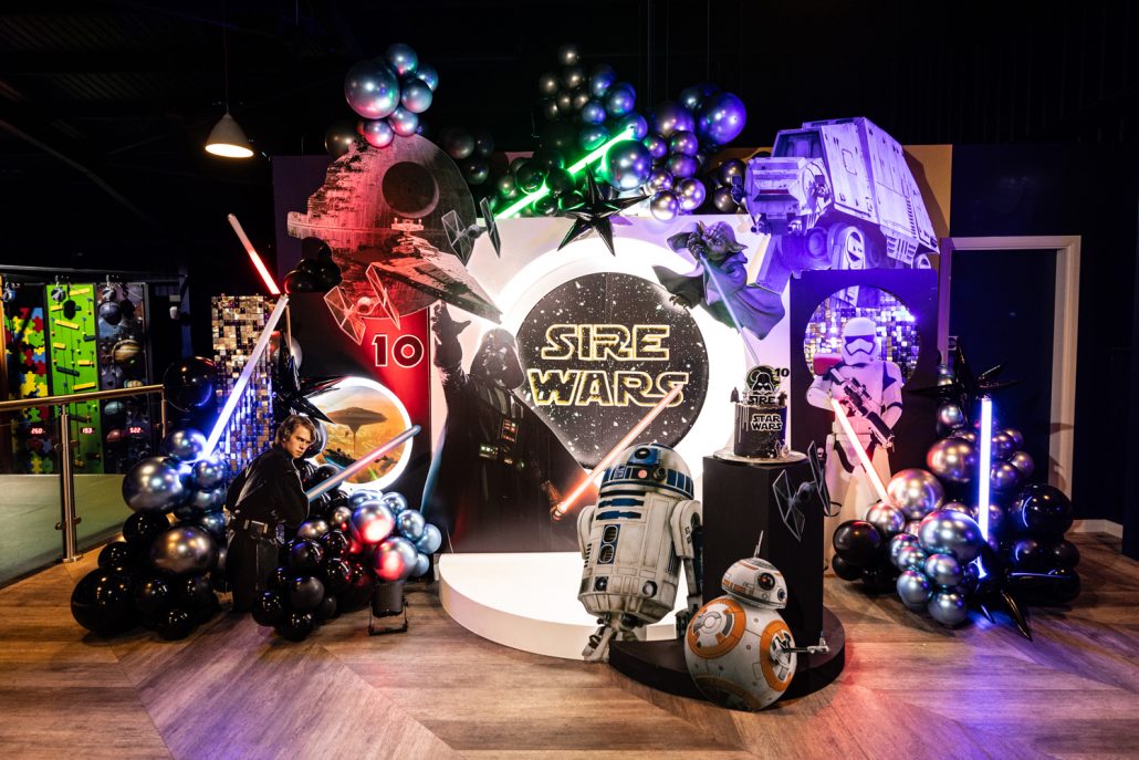 Star Wars themed 10th birthday party portrait with father and son posing with lightsabers – Party Photographer Manchester