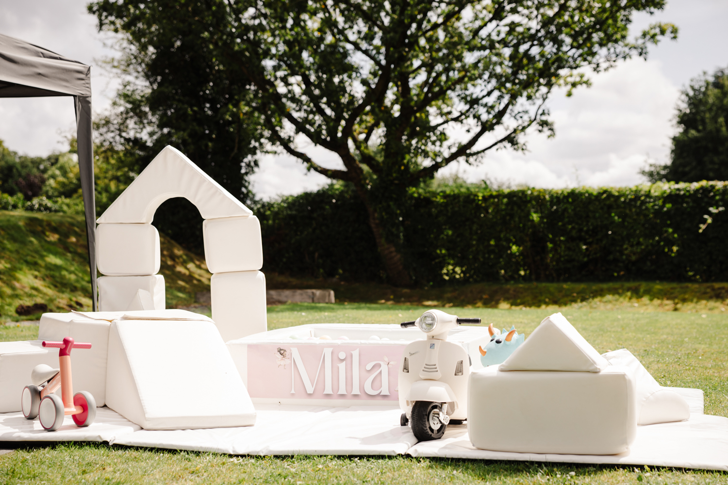 Pink sparkling drinks in champagne flutes with floral garnish at a stylish birthday party in Manchester