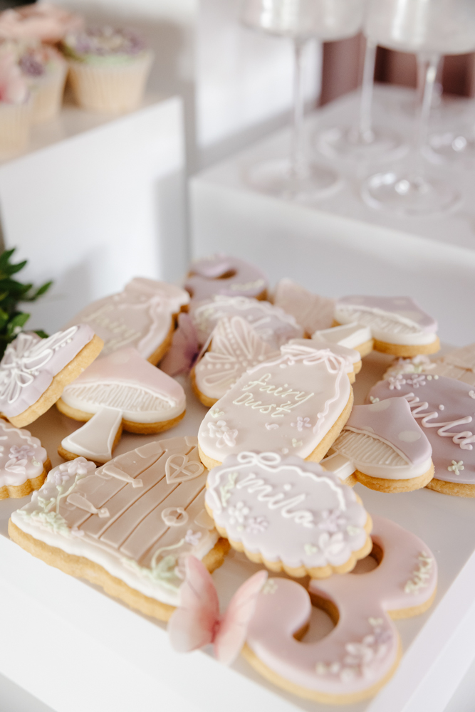 Children throwing pink and purple confetti at a fun-filled birthday party, captured by a Birthday Party Photographer Manchester