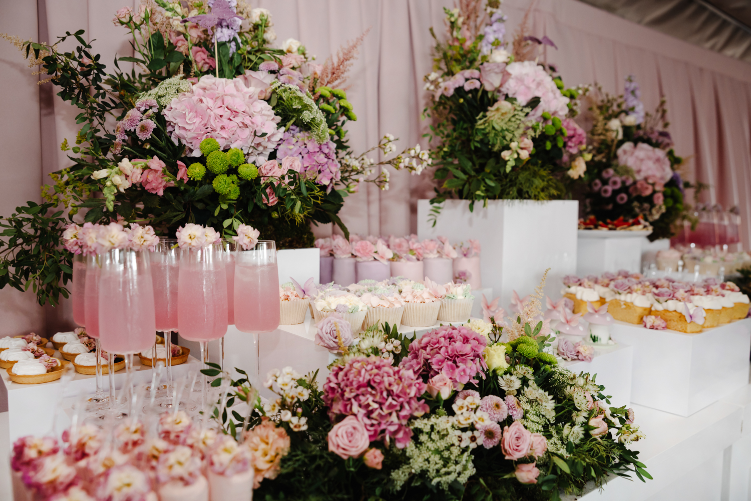 Soft play setup outdoors with neutral toys and personalised “Mila” sign at a children’s birthday party in Manchester