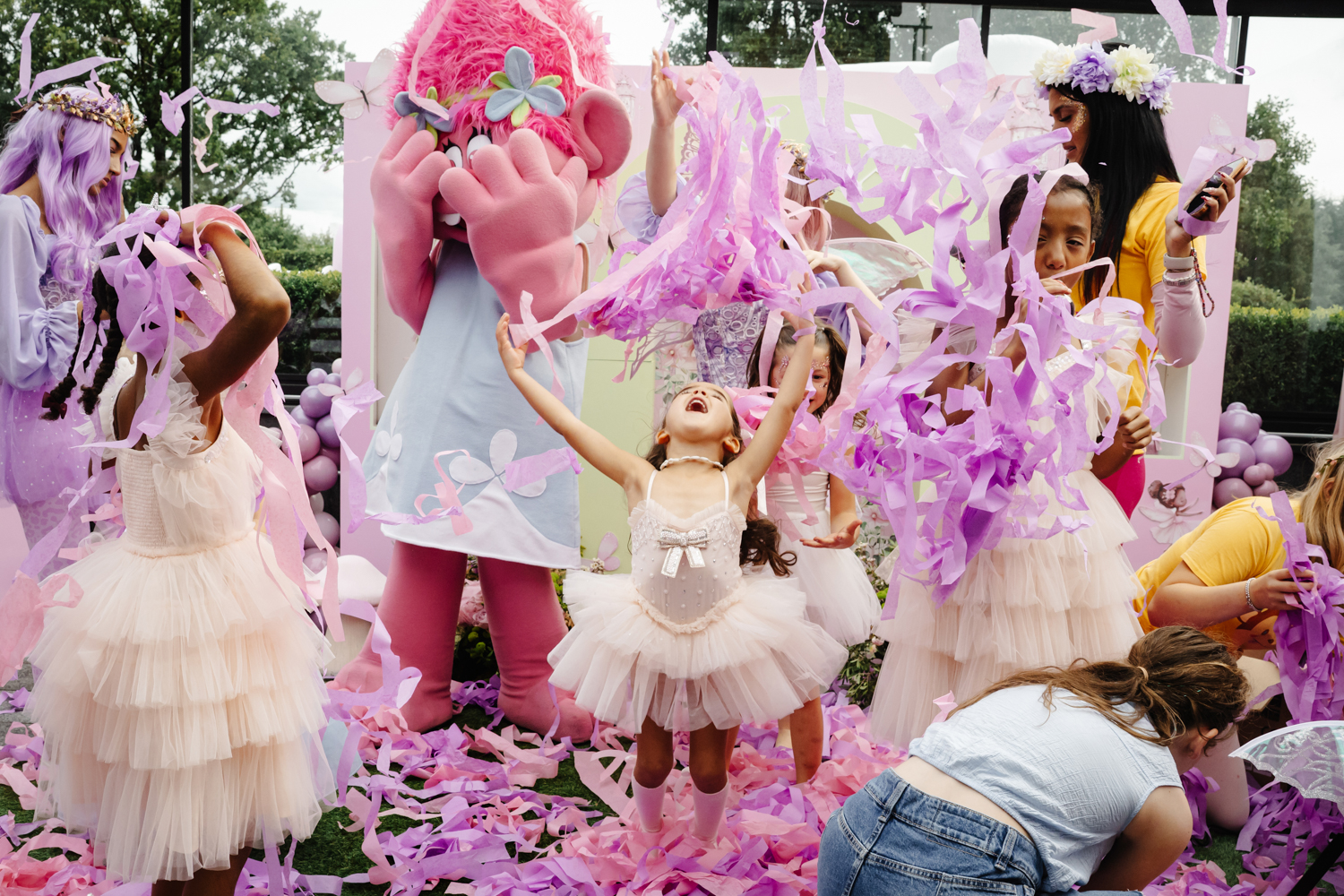 Pink sparkling drinks in champagne flutes with floral garnish at a stylish birthday party in Manchester