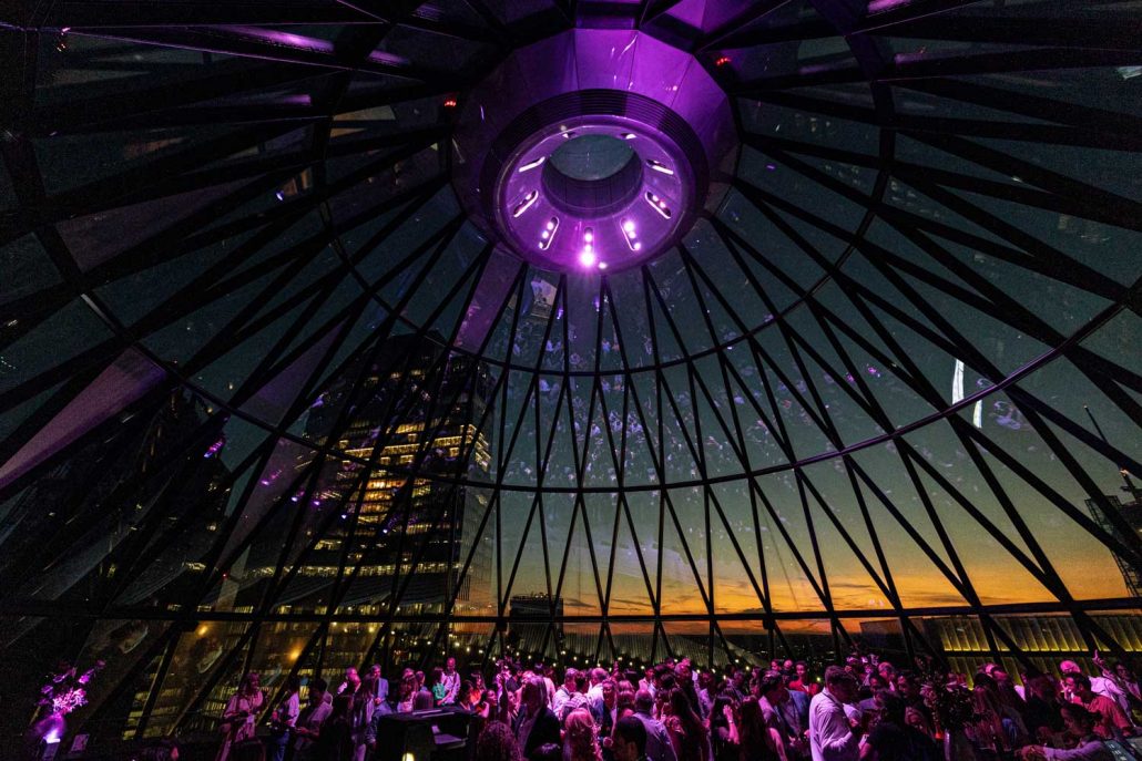 Event Photographer London capturing corporate summer party under glass dome skylin