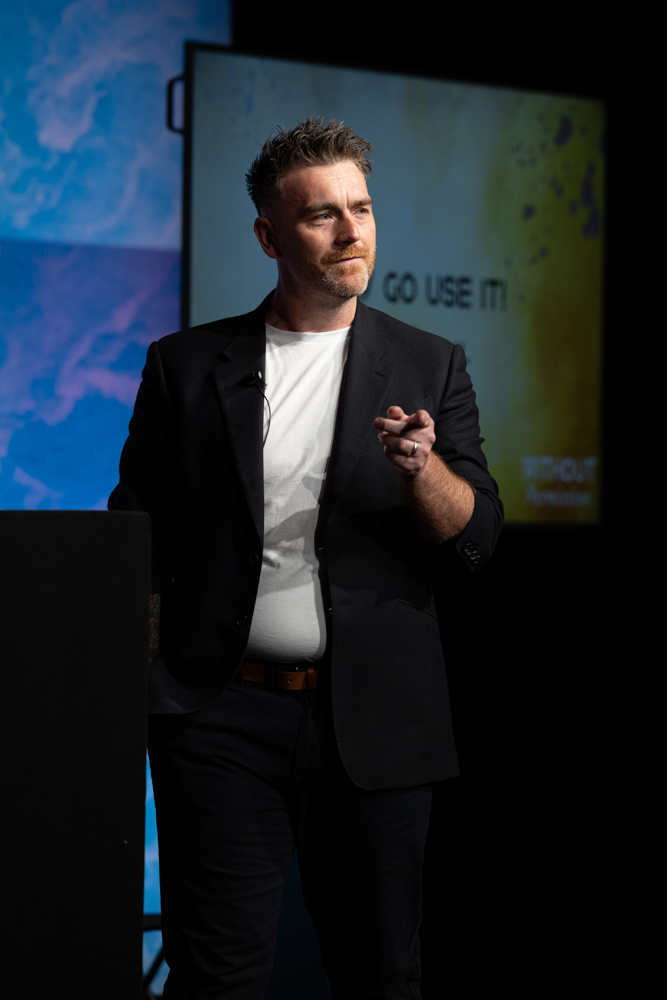 Male keynote speaker presenting on stage during Plannex Conference, Conference Photographer Manchester