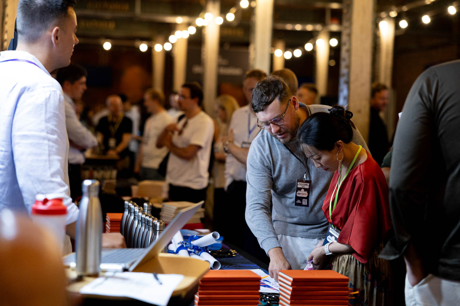 Networking and exhibition area with attendees interacting at Manchester conference, Conference Photographer Manchester