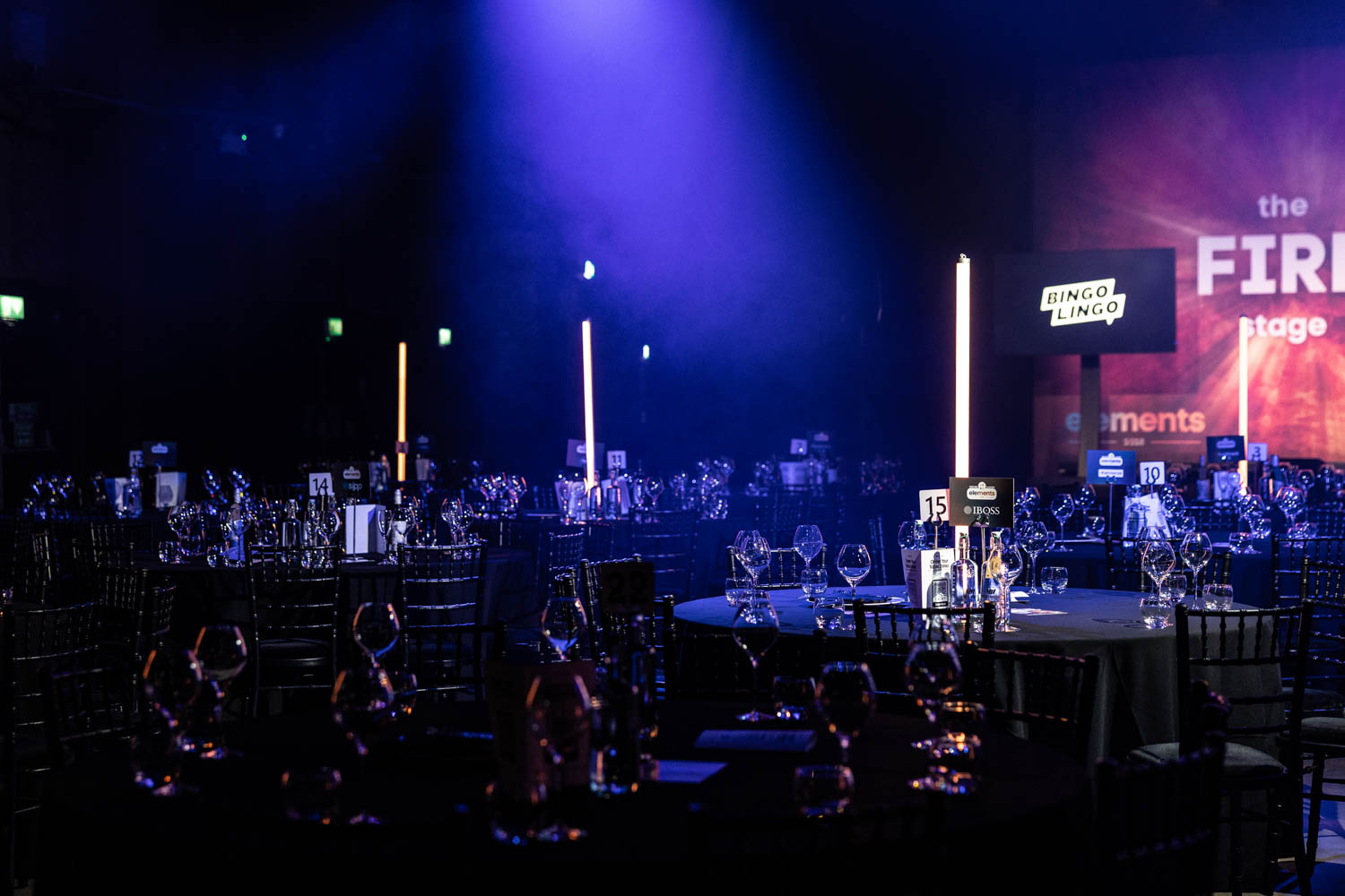 Conference Photographer Manchester capturing elegant conference evening event setup with stage lighting and table décor