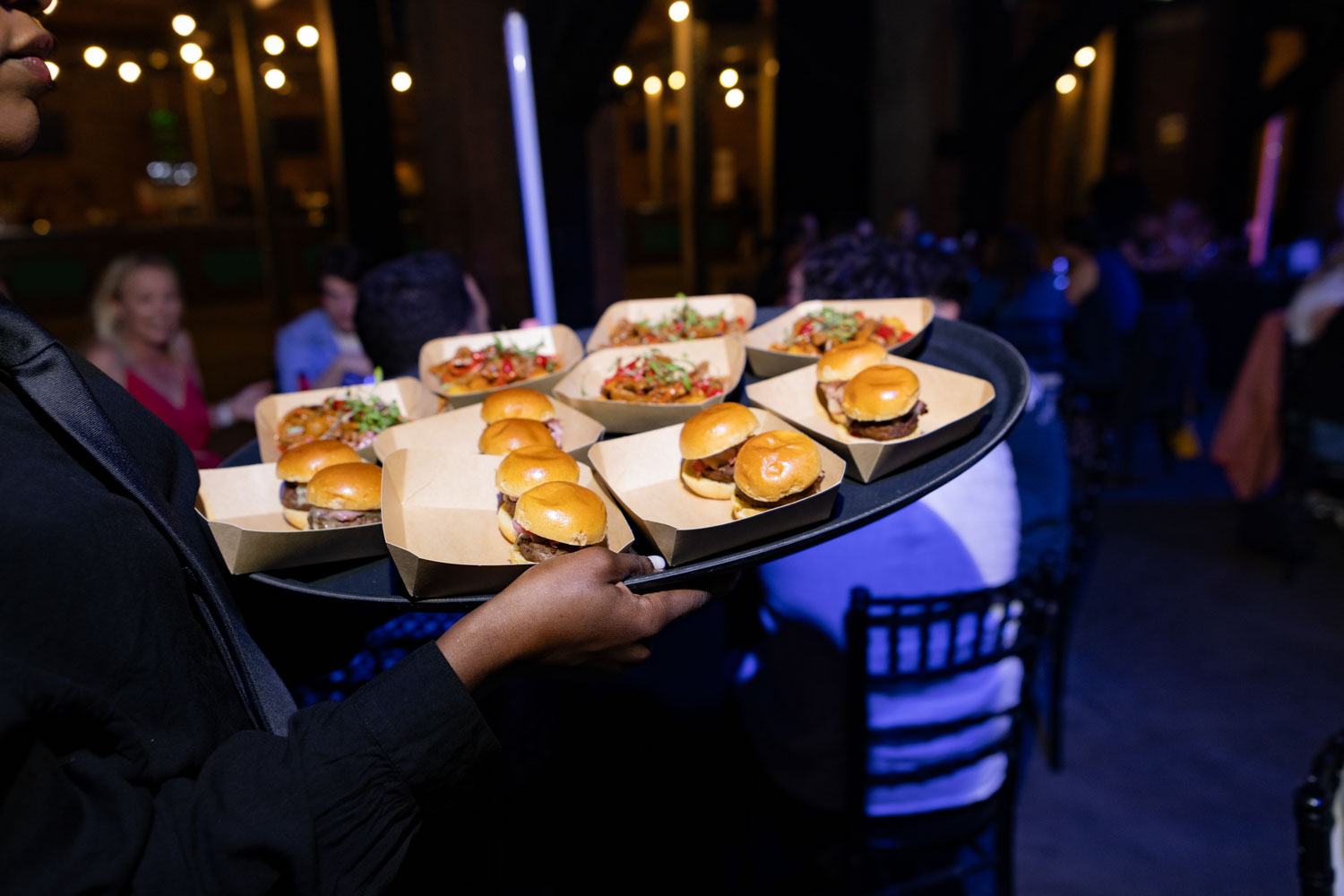 Conference Photographer Manchester capturing tray service with sliders at networking conference event