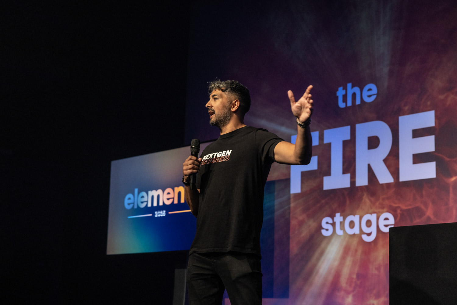 Conference Photographer Manchester capturing keynote speaker presenting on stage at Plannex conference evening