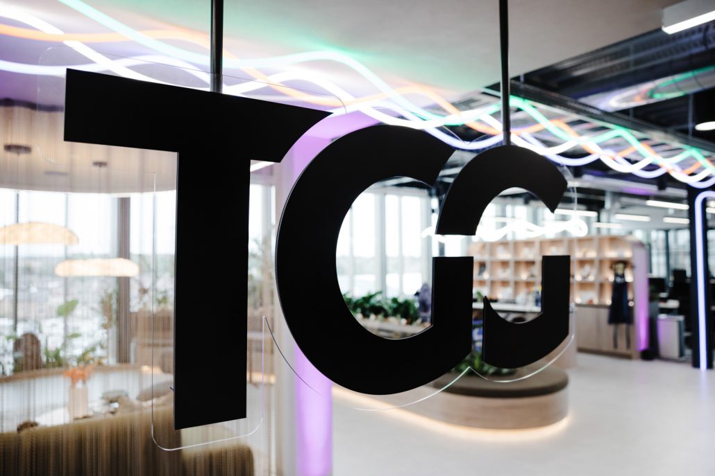 TGG logo displayed inside the modern reception area at the new office opening launch party in Manchester